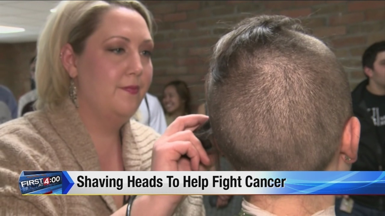 Students shave heads to help support cancer patients